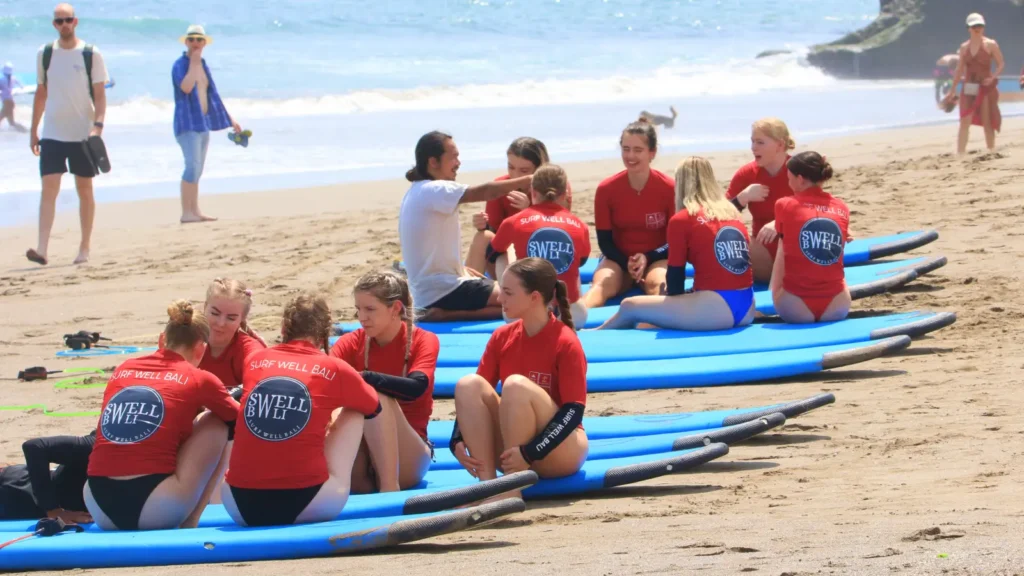 Instructor is giving surfing lessons at Canggu Beach, Bali