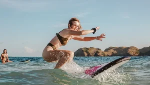 girl try riding wave on kuta lombok