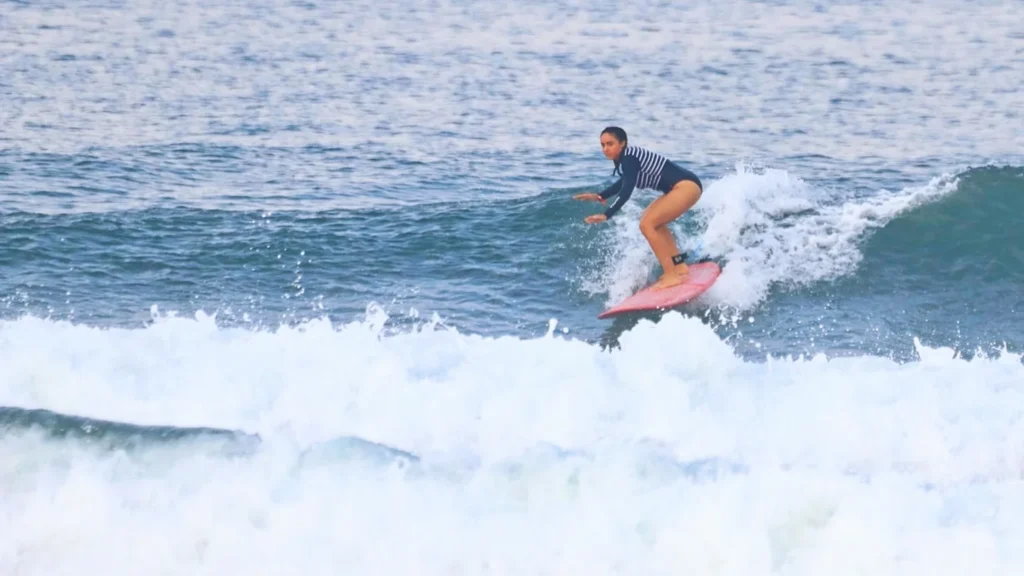 Surfer riding a powerful wave at Uluwatu Bali during perfect surf conditions