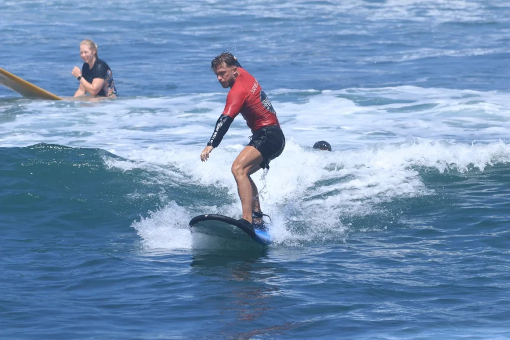 Learning how to pop up and paddle at Surfwell Surf School, Canggu